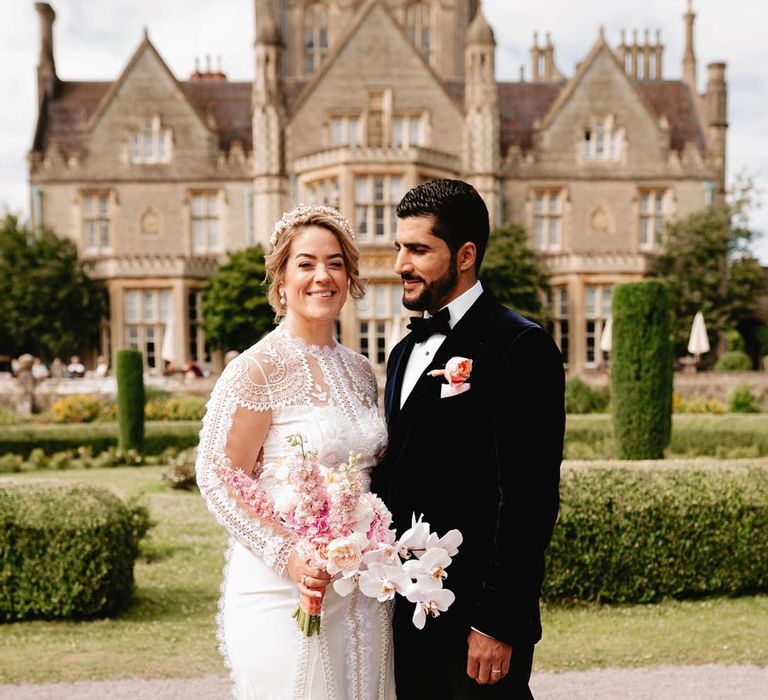 Classic and luxury De Vere Tortworth Court wedding with the bride in a Temperley Bridal wedding dress and groom in velvet suit jacket