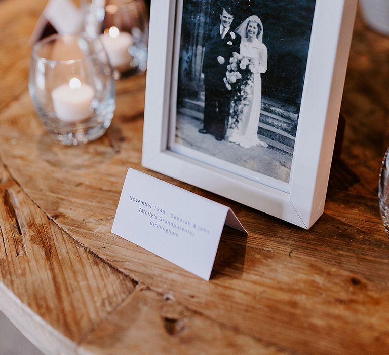 In memorial of lost loved ones there are wedding photos of the bride and groom 