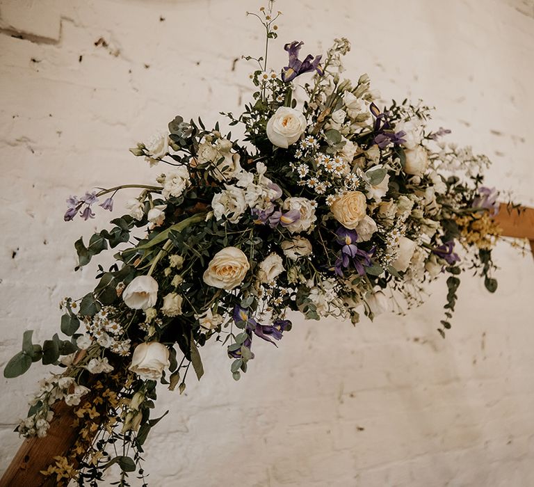 white and lilac wedding flowers with green foliage 