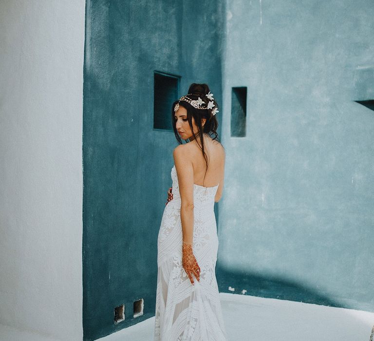 Boho bride in lace wedding dress with white flower hair accessories and a jewelled matha patti at Tigre Del Mar 