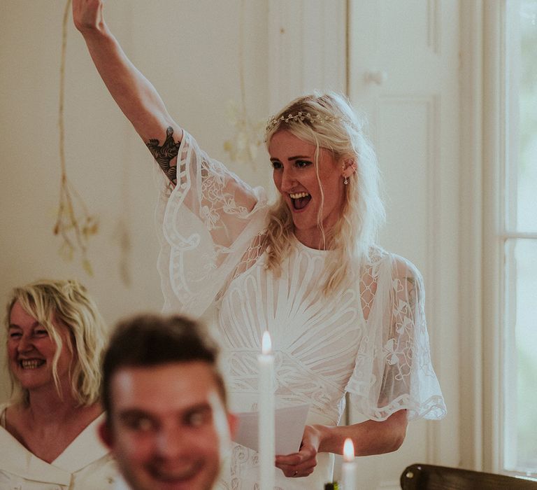 Blonde bride in short sleeve ASOS wedding dress with diamanté tiara 