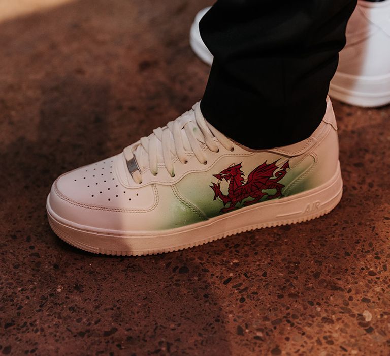 Personalised white Air Force Ones with Welsh flag detail for the wedding trainers 