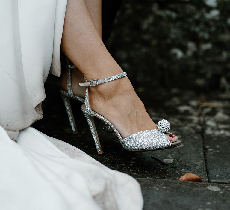 Bride wearing sparkly embellished Jimmy Choo wedding shoes to complement her simple Jane Hill wedding dress 