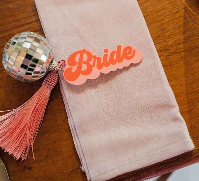 Pink wedding place name with retro font and mini disco ball 