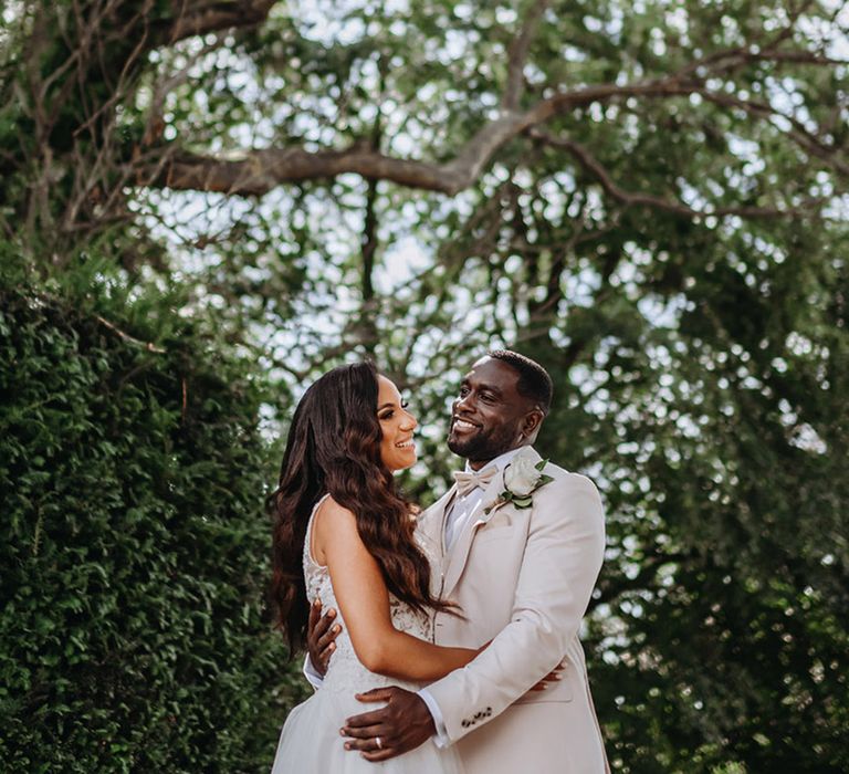 The bride and groom pose for their couple portraits 