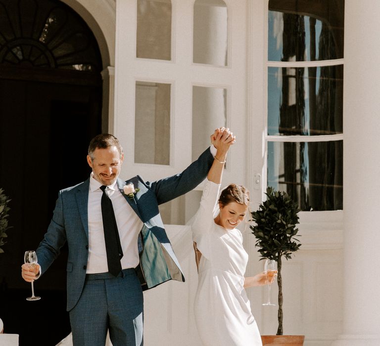 Bride and groom celebrate at Pylewell Park