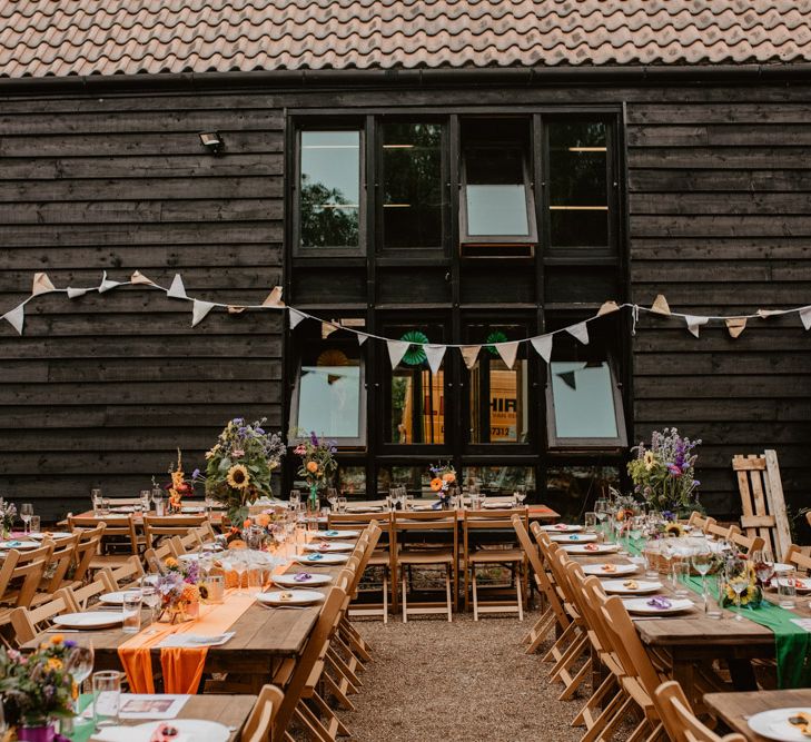 Outdoor farm wedding with diy rainbow wedding decor 