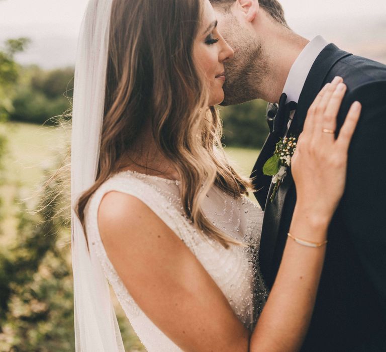 Newly-wed bride and groom kissing at Italy wedding