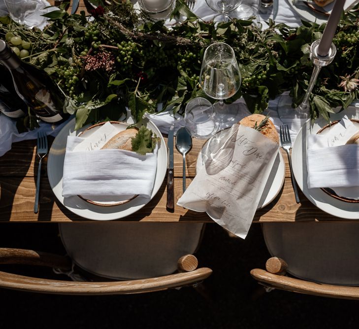 Place settings with fresh bread and natural linens 