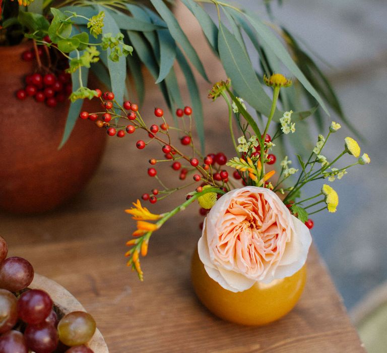 Pink flowers in ceramic and terracotta pots for a Greek destination wedding