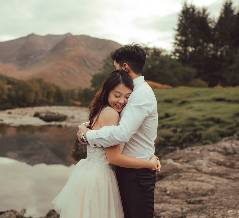 Couple hug during engagement session