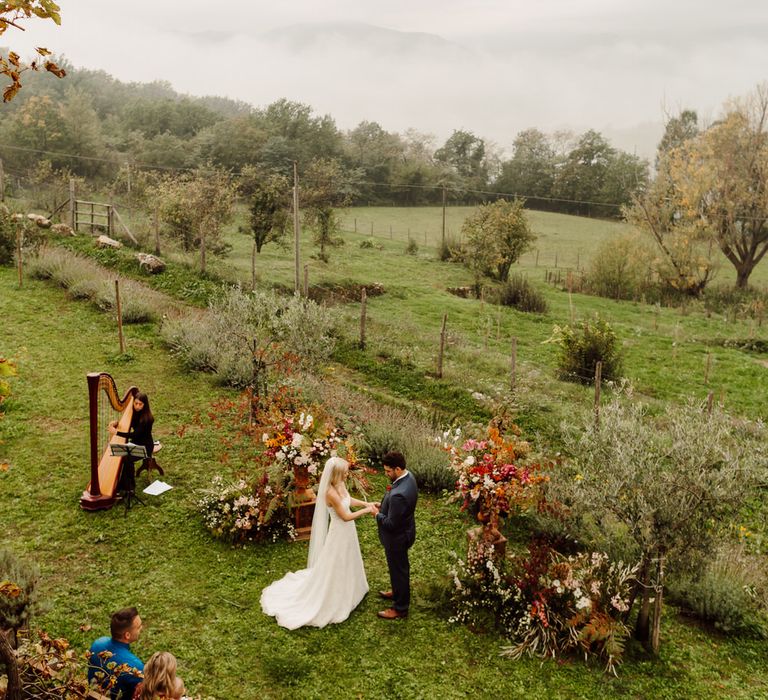 The bride and groom elope in Italy in front of four guests while a harpist plays