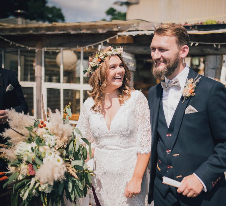 Bride & groom walk together on their wedding day