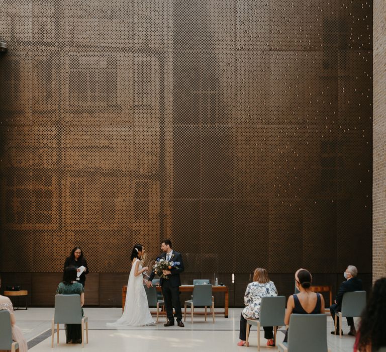 Bride and groom getting married at Hackney Town Hall