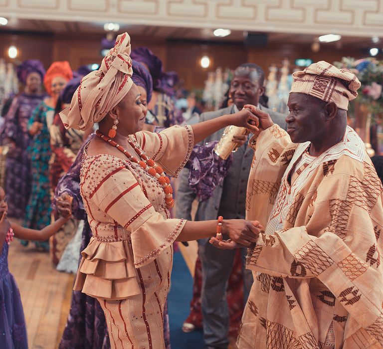 Wedding guests dance during reception