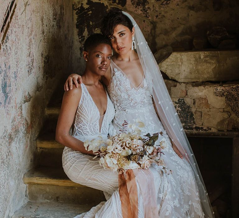 Two brides in appliqué and embellished wedding dresses by Made With Love Bridal