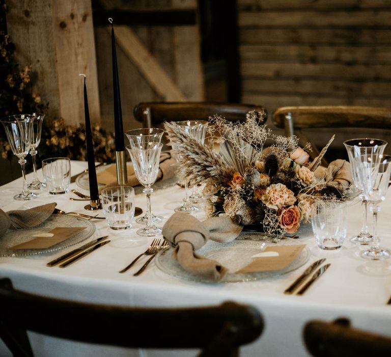 Rustic luxe wedding ideas with neutral flower centrepiece and linen napkins