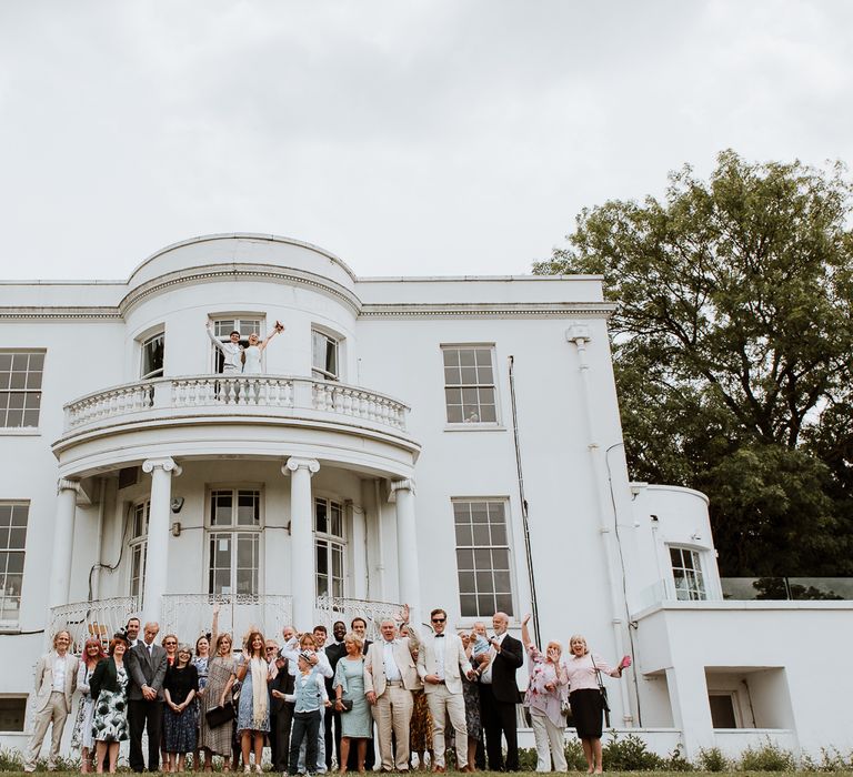 Bride & groom celebrate with wedding party at the Belair House 