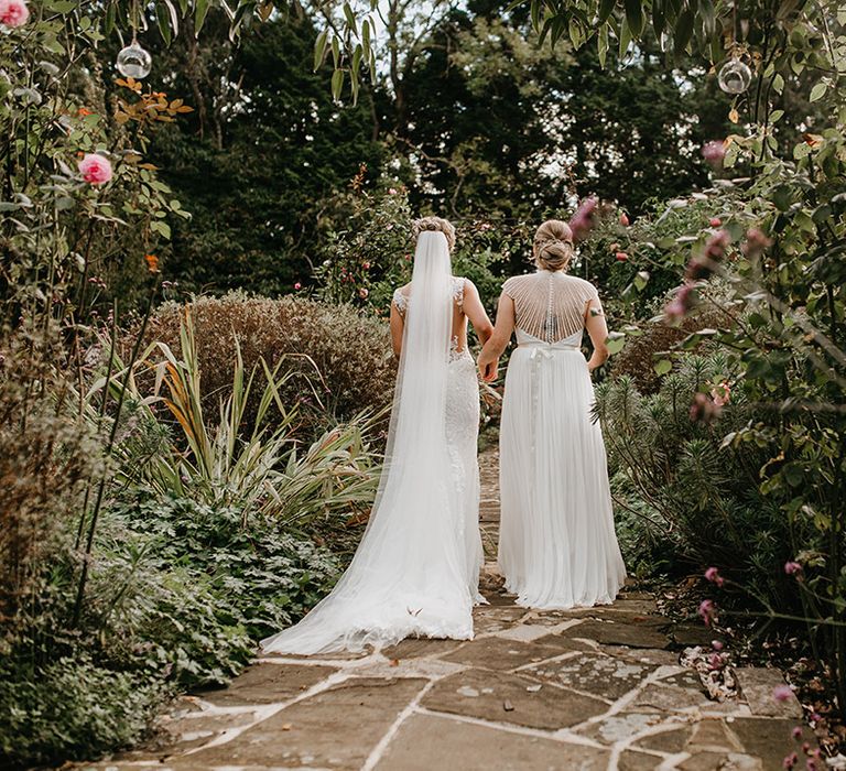 Brides walk together on their wedding day