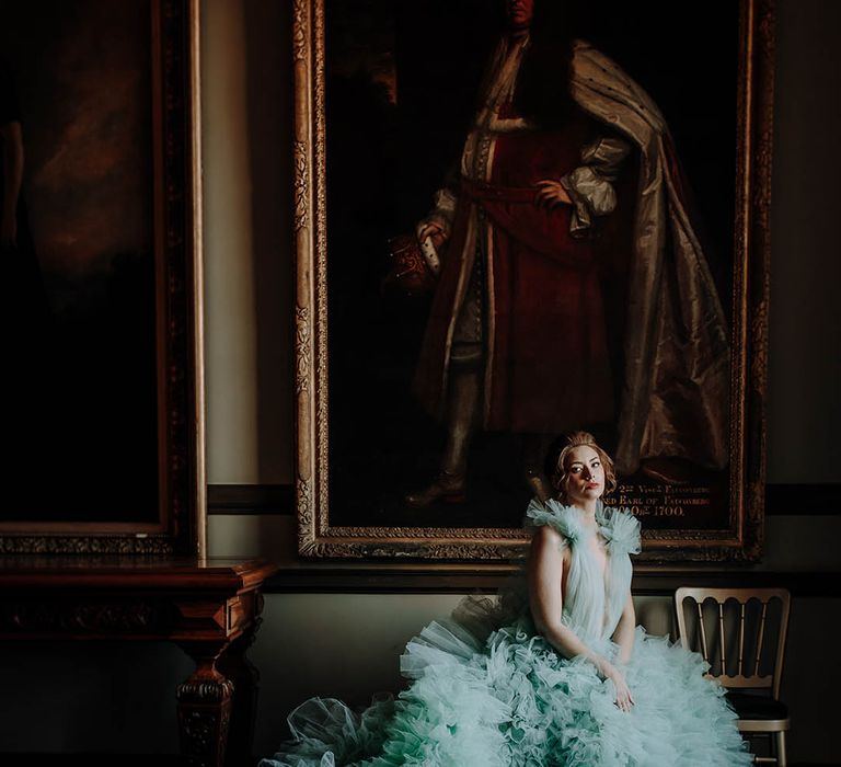 luxury wedding inspiration with a bride in a tulle ruffled light blue wedding dress by Millia London 