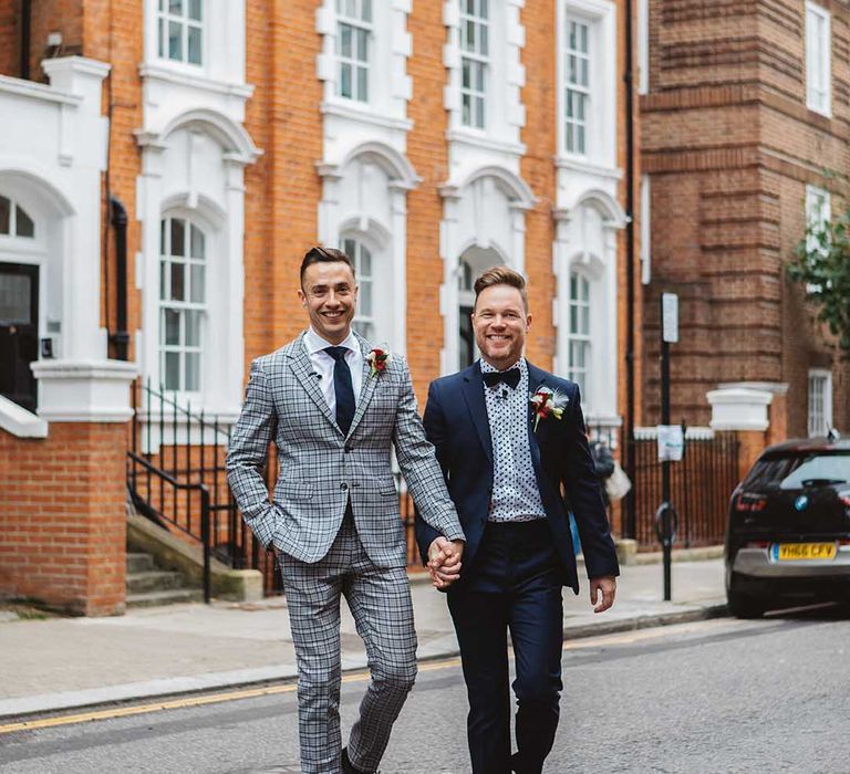 Grooms walks through Chelsea on their wedding day 