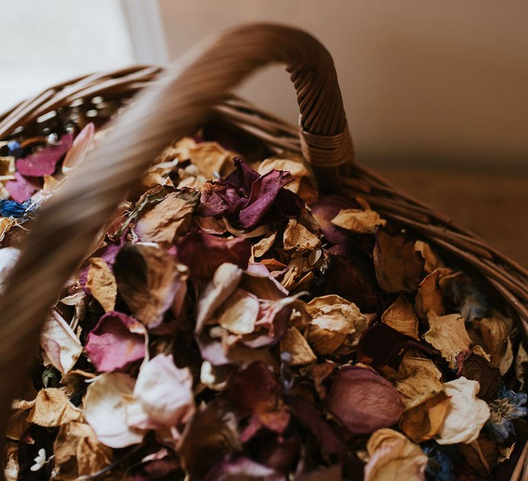 Dried petal confetti in wicker basket 