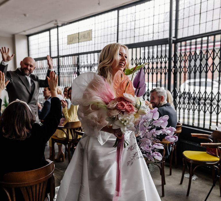 Pastel pink, white and lilac wedding bouquet with orchids, anthuriums, ranunculus and roses