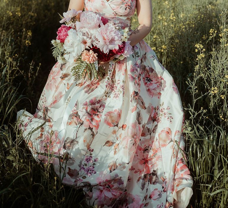 Bride in pink flower hand painted silk wedding dress with pink, white and dark pink wedding bouquet 