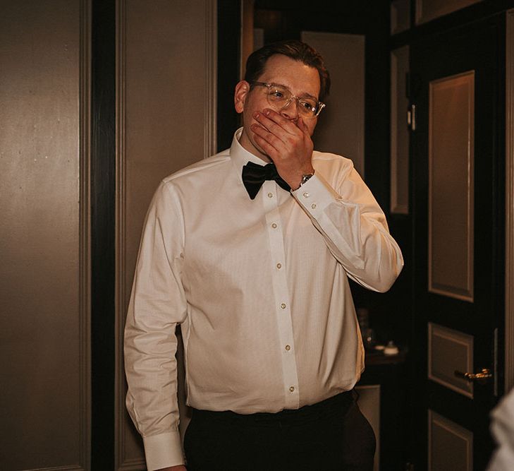 Groom wears black-tie and sees his bride for the first time on the morning of their wedding day