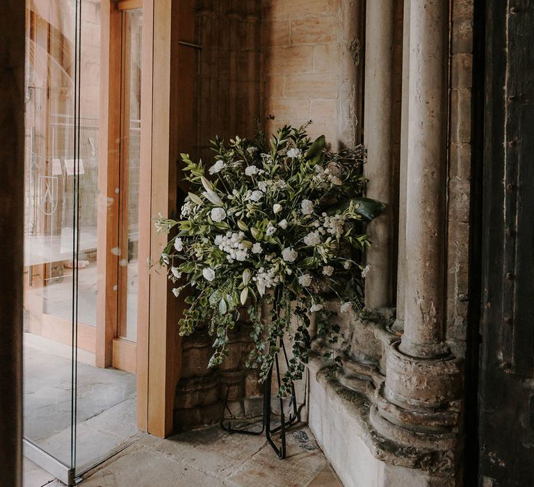 Traditional white wedding flower display for a classic church wedding 