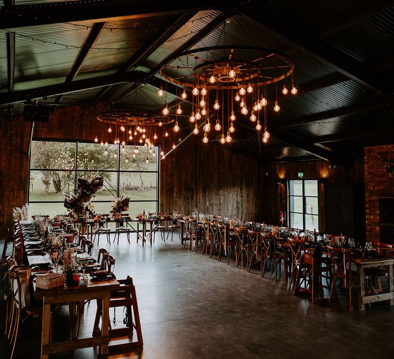 Silchester Farm wedding venue with dried flower decor and festoon lighting 