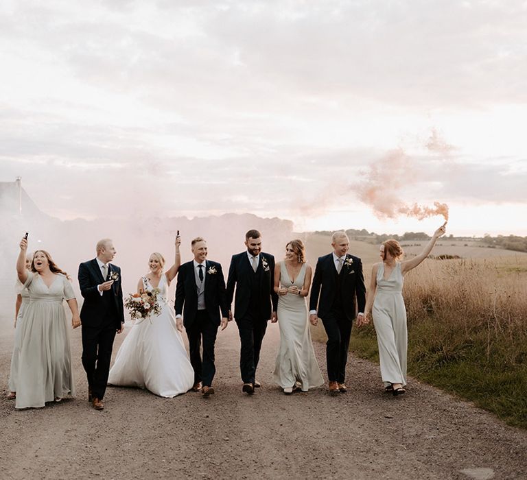 Smoke bomb moment for the whole wedding party 