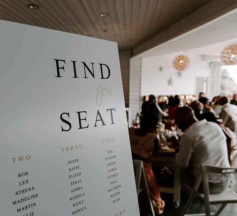 Minimalist wedding table plan at Tunnels Beaches coastal wedding in Devon