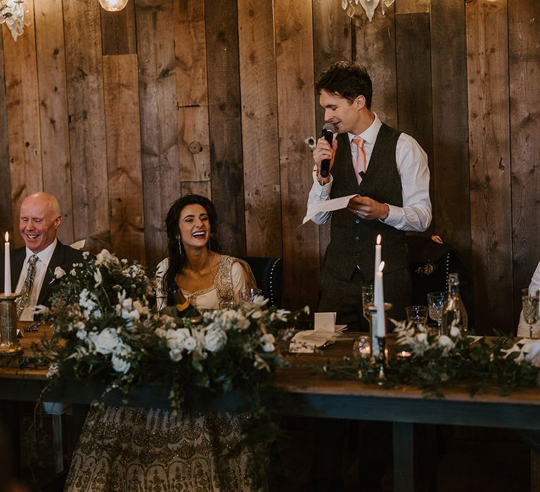 The groom stands up to read out his wedding speech 