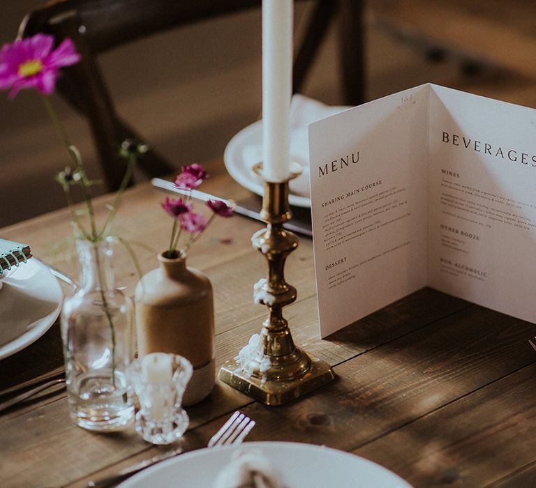 Black and white wedding menu booklet on the wedding tables 