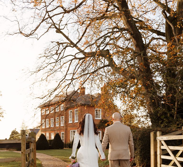 Sandon Manor country house wedding with the bride and groom walking around the venue 