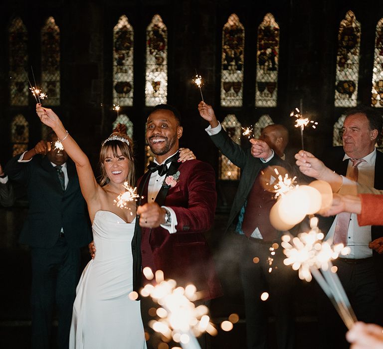 The bride and groom have their sparkler send off at their castle wedding in the Cotswolds