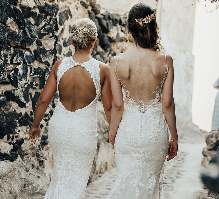 Bride in delicate boho lace wedding dresses with open back detail for lesbian wedding 