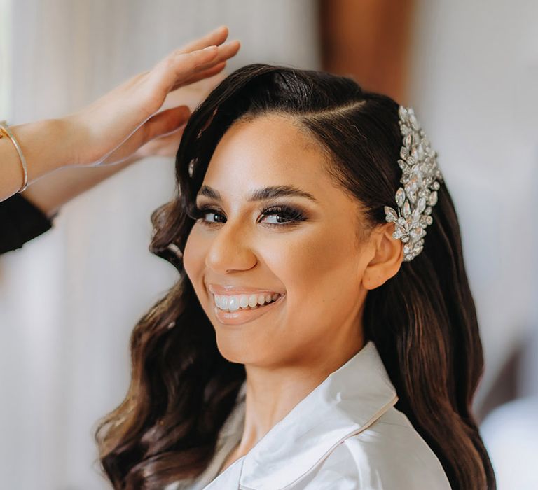 Bride with Hollywood wave side swept hair clipped with sparkly bridal hair accessory 