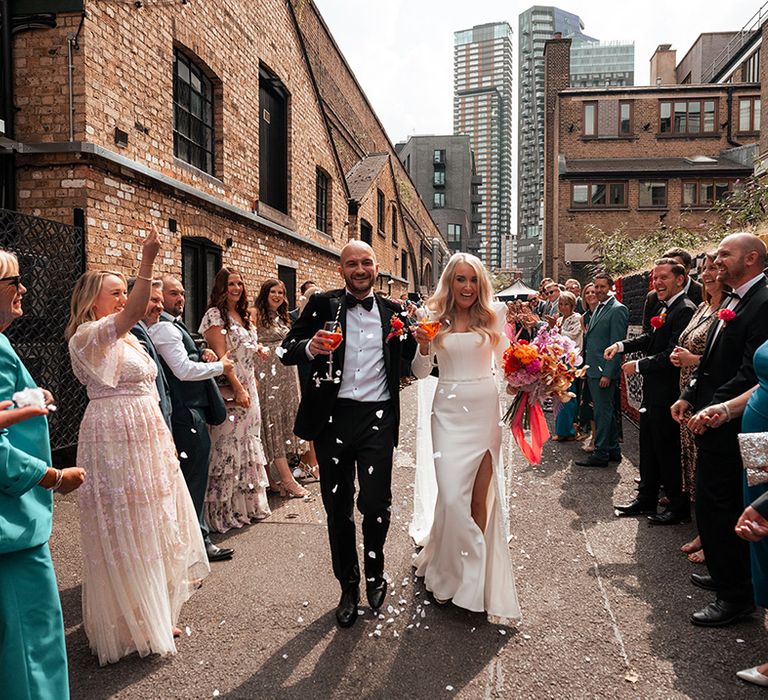 Confetti moment for bride and groom at Shoreditch Studios wedding 