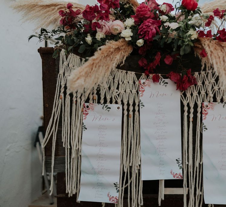 Macrame wedding decor with pampas grass and pink flowers