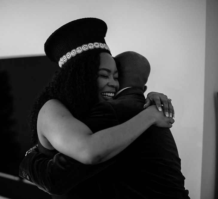 Black and white portrait of bride and groom embracing on the wedding morning 