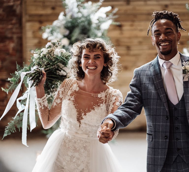 The bride and groom celebrate their marriage at Sedgewell Barn in Yorkshire