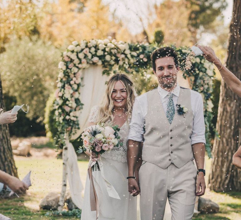 The bride and groom walk down the aisle at La Mas De La Rose