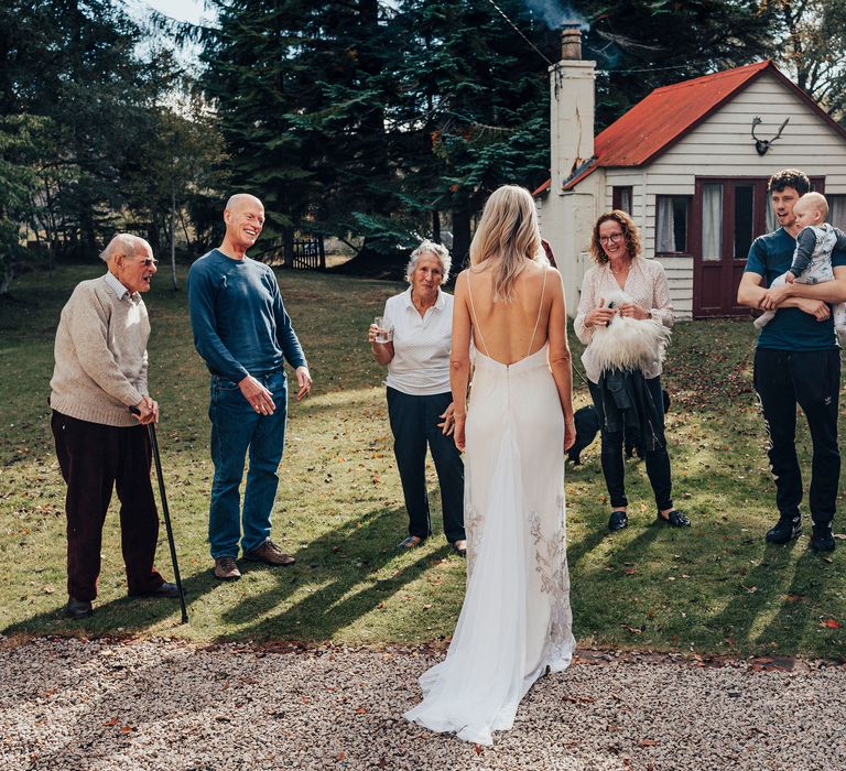 Bride reveals herself to wedding guests for the first time