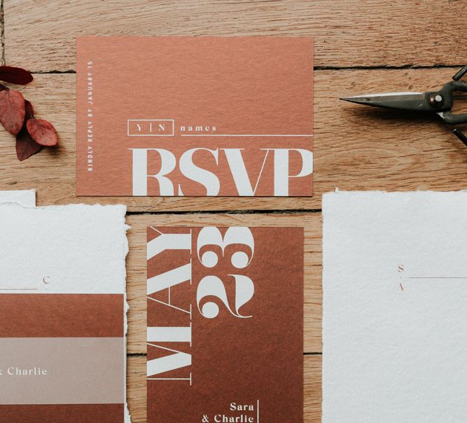 Modern wedding stationery with bold typography in rustic earthy colours. Photography by Anne-Sophie Benoit.