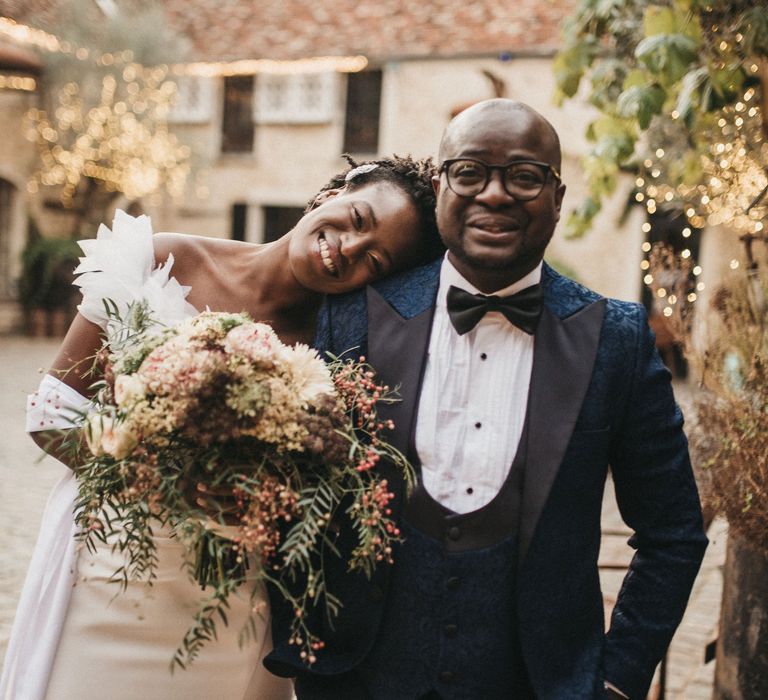 Father of the bride in a navy blu tuxedo with black lapels with his daughter in a Georges Hobeika wedding dress 