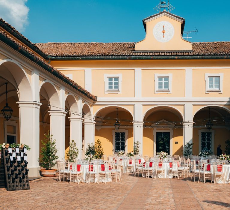 Outdoor wedding dinner reception in the courtyard of Tenuta Pegazzera