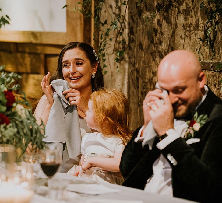 Emotional bride and groom at the wedding reception speeches 