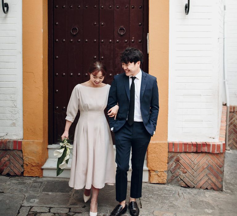 Asian couple in doorway in Seville